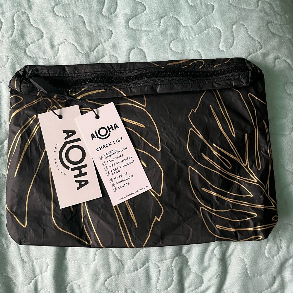 Aloha Collection small Lanai pouch in gold on black. NWT